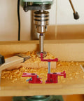 Heavy Duty 1/2 Inch Pipe Clamp Set With Rubber Padded Sleeves For Rock Solid Wood Glue Joints And Sturdy Frame Builds in use on a drill press.