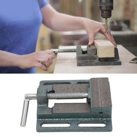 Beefy 3 Inch High Carbon Steel Drill Press Vise with raised widened jaws holding wood for precise woodworking and metalworking.