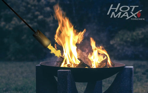 Powerful 500,000 BTU Propane Torch With Easy Grip Molded Handle used on outdoor fire pit, clean burn visible
