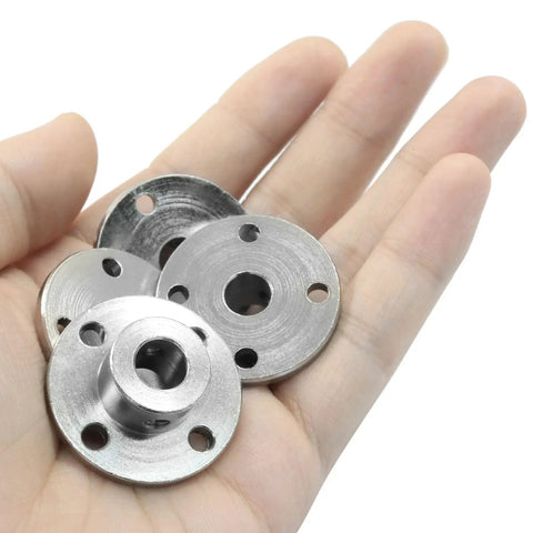 Rigid 8mm Flange Coupling Connector Set in hand, showing size and material for DIY RC model motors and shaft axis projects.