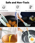 Ultimate Camping Kitchen Utensils Set For Outdoor Cooking Portable Silicone Cookware Kit in use with various utensils on stovetop