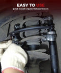 2-Piece Coil Spring Compressor Kit in use on automotive strut with double retention anti-drop system and safeguard brace