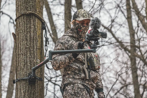 Hunter using Stiff Arm Tree Camera Arm Mount, Lightweight Aluminum With 360 Tool-Less Leveling, stable filming bracket attached to a tree.