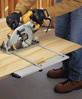 Using a Kickass Lightweight Aluminum Rip Guide with smooth dual port config for precise cuts on plywood sheet.