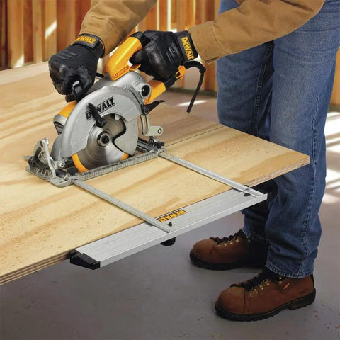 Using a Kickass Lightweight Aluminum Rip Guide with smooth dual port config for precise cuts on plywood sheet.