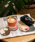 8 Piece Dope Cocktail Diamond Painting Coaster Set With Holder For Drinks And Coffee Table displayed on magazine with coffee