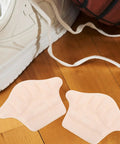 Game Changing Heel Grips And Liner Cushions To Tighten Up Loose Shoes Anti Chafing Beige Shoe Inserts for snug fit next to sneakers.