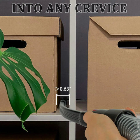 Flexible Crevice Tool And Extension Hose Kit for Cordless Vacuums in use between storage boxes and plant for tight spaces