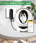 No Fuss Heavy Duty Plug And Play Car Jump Starter Power Cord Replacement Charger Adapter 15V 1A on table with cat in Litter Robot.