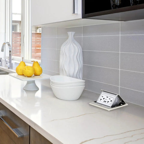 Pop Up Floor Outlet Box With 20 Amp Tamper Resistant Type A And Type C USB 5V 5A Receptacle Corrosion Resistant Hardware ETL Listed Brushed Nickel Finish Durable Floor Box Kit shown installed in a modern kitchen countertop