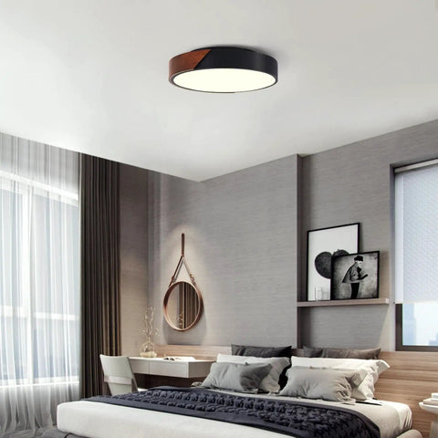 Slick Modern Black Wood Look Flush Mount Ceiling Light 3 Light Fixture in stylish bedroom setting
