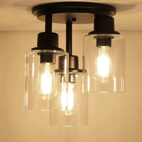 Three Light Matte Black Dope Semi Flush Mount Ceiling Light With Clear Glass Shades installed for rustic industrial style room