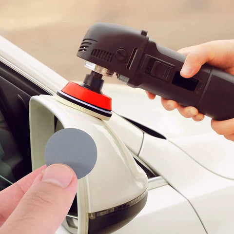 Grab These Awesome Parliky 180 Sheet Round Hook And Loop Sanding Discs With Amazing Flexibility, Super Tear Resistance, Anti-Clog Design For Woodworking And Polishing Tasks At Gritty Good Prices Today, demonstrating use on a car mirror.