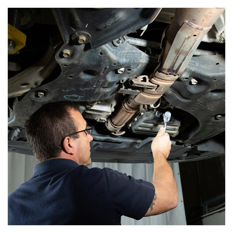Mechanic using Drain Plug Socket Set For Oil Changes And Vehicle Maintenance Pro Includes Hex And Square Metric Sockets Works On Foreign And Domestic Cars Like BMW Ford Mazda Mercedes Nissan Peugeot Renault Eases Oil Plug Removal And Transfer Case Drains under car