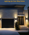 Modern Outdoor Wall Lights Up and Down Cylinder Sconce Matte Black Pack of 2 illuminating a home’s garage and entryway at night