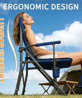 Person sitting on heavy duty camping chairs 2 pack with 500 lbs capacity, folding lawn chair with wide seat and hard armrests.