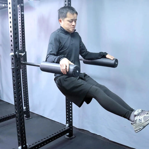 Man using Single Leg Squat Roller Attachment for Power Rack and Home Gym, Nordic Curls Kit for leg exercise
