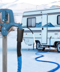 RVMATE heated water hose for RV, blue exterior with insulated black sleeve and white connector, RV in background.