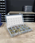 Hardcore Grade 8 Hex Cap Bolts Assortment Kit With Secure Grip Nuts And Washers in clear organizer on wooden table.