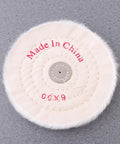 Close-up of a single white cloth polishing wheel from the 2 Pack White Cloth Polishing Wheels 6 Inch Buffing Discs For Jewelry Metal And Glass Heavy Duty Abrasive Grinding Wheel Set With Low Noise And Rust Removal Workhorse Durability Alumina Construction.