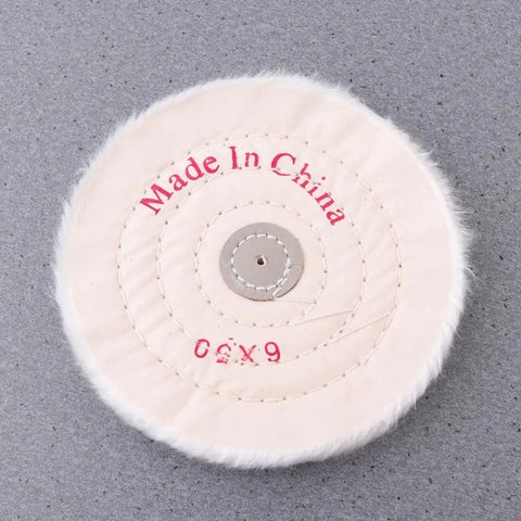 Close-up of a single white cloth polishing wheel from the 2 Pack White Cloth Polishing Wheels 6 Inch Buffing Discs For Jewelry Metal And Glass Heavy Duty Abrasive Grinding Wheel Set With Low Noise And Rust Removal Workhorse Durability Alumina Construction.
