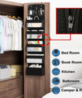Heavy Duty Over The Door Organizer And Hanging Closet Storage Rack With Multiple Pockets in black attached to a wooden door.