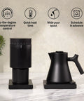 Corvo EKG Pro Electric Tea Kettle With Precise Temperature Control Quick Heat Scheduling And Built In Brew Timer Matte Black With Walnut Handle 0.9 Liter Capacity For Tea Coffee And Cooking displayed next to matching grinder on counter.