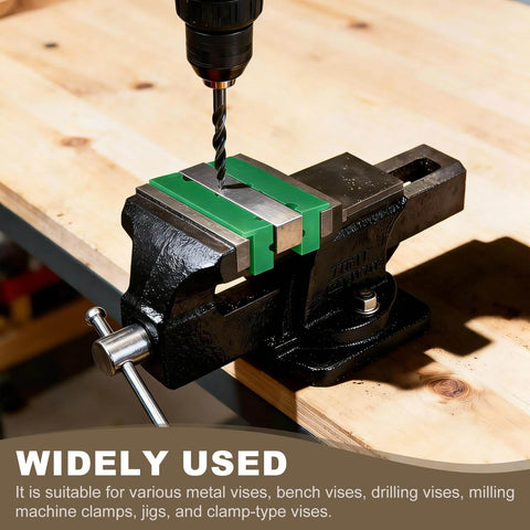 Drill press using a bench vise with V shape magnetic jaw pads for secure woodworking clamping