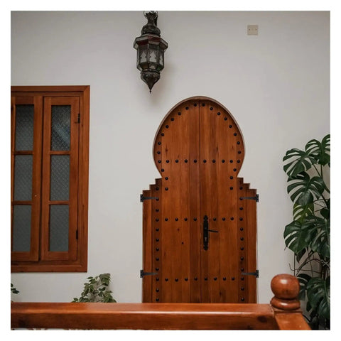 Wooden door with Six Inch T Shape Beefy Rustproof Iron Light Duty Shed Hinge Set used for DIY gates and doors.