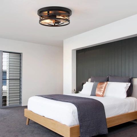 Black Flush Mount Ceiling Light Industrial Vintage Metal Cage Fixture in modern bedroom with wooden bed and grey decor.
