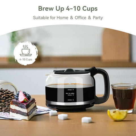Grind And Brew 10-Cup Coffee Maker With Built-In Burr Grinder on kitchen counter with glass carafe, next to cake and coffee.