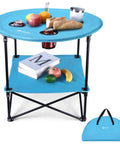 Folding Camping Table Lightweight Double Layer Round Table With 4 Cup Holders And Carry Bag Portable Beach Table For Camping Travel Fishing And Outdoor Activities Blue, shown with food items.