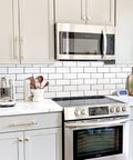 Subway Tile Peel And Stick Backsplash Kit With 10 Sheets In Polished White Ceramic Look Wall Tiles For Kitchen And Bathroom Easy DIY Install No Mess Realistic Texture shown in a modern kitchen setting.