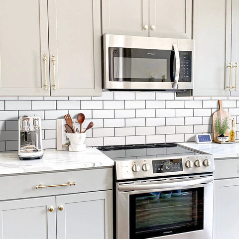 Subway Tile Peel And Stick Backsplash Kit With 10 Sheets In Polished White Ceramic Look Wall Tiles For Kitchen And Bathroom Easy DIY Install No Mess Realistic Texture shown in a modern kitchen setting.