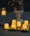 Flameless Votive Candles 24 Pack LED Tea Lights With Realistic Flicker, Battery Operated Warm White on table with decor