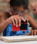 Child using drill from 4-In-1 Woodworking Kit For Kids Ages 8 And Up Lathe Drill Sander And Saw STEM DIY Project Tool Set
