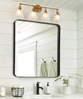Hot Gold Bathroom Light Fixtures Modern Farmhouse Vanity Lights Over Mirror Four Light Vanity Lighting With Frosted Glass Shades For Bright Warm Bath Ambiance in a white shiplap bathroom