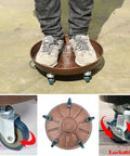 Big Boy Rolling Plant Dolly With Lockable Casters For Smooth Riding Indoors Or Outdoors, Built Like A Tank At Four Hundred Twenty Lb Capacity, Thickened Steel Pan With No Cutouts, Fits Twelve To Fifteen Inch Pots, Pack Of Two, showing person standing on dolly with four lockable casters.