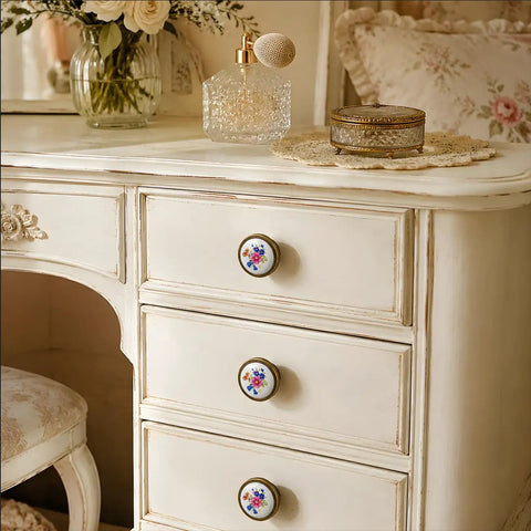 Vintage Floral Ceramic Cabinet Knobs And Drawer Pulls Featuring Dual Mounting Screws For A Super Easy Kitchen Cupboard Or Dresser Hardware Swap That Brings Chill Vibes on a white dresser.