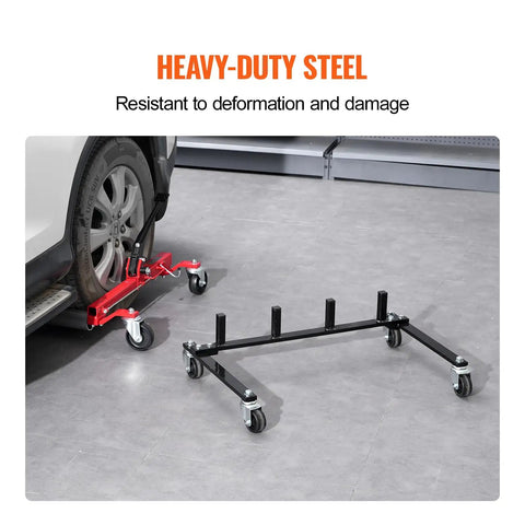 Car Dolly Rack Storage Organizer with 360 Degree Rotatable Wheels next to car tire and black trolley in garage setting.
