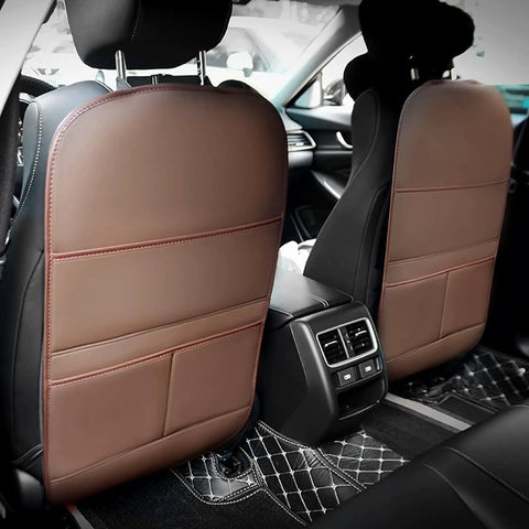 Anti Kick Seat Back Protector For Tesla Cybertruck 2023 And 2024 with faux leather panel and storage pockets in car interior.