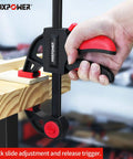 Close-up of hand operating 24 Inch Bar Clamp And 31 Inch Spreader Set for Woodworking Quick Release Clamps Pack Of 4 in use on wood