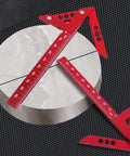 Sick Aluminum Alloy Woodworking Square For Dead Center Layout And 45 90 Degree Angle Measuring Tool With Sharp Scribe Ruler In Bold Red Metric Workshop Finish on marble.