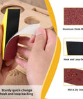 Close-up of micro sander kit showing quick-change hook and loop backing with aluminum oxide sandpaper.