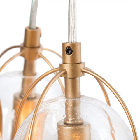 Close-up of Gold Modern 3-Light Pendant Chandelier With Seeded Glass Shades showing detailed glass and gold finish.