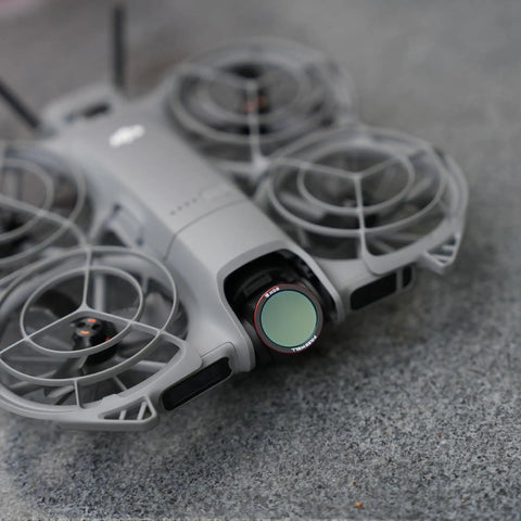 Close-up of DJI Neo 2 drone with attached magnetic ND filter from 3 Pack Magnetic ND Filters For DJI Neo 2 Drone Includes ND8 ND16 ND32.