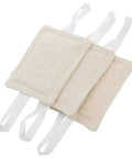 Beige tool-free door silencers with straps, part of a 9-piece set for quieter homes or classrooms, installed on knobs or latches.
