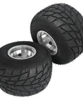 Two 11x7.10-5 black racer tires with 5 inch wheels for Heavy Duty 32 Inch Go Kart Rear Live Axle Kit with tread pattern visible.