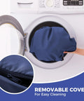 Removable cover of All Weather Outdoor Bench Cushion 48x18x3 Inch Navy Blue Waterproof Seat Pad shown in washing machine for easy cleaning.