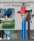 Diamond core drilling rig with blue 2.5-inch core barrel and red motor mounted on a vertical stand